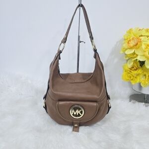 Michael Kors leather hobo with one main compartment and two outside compartments